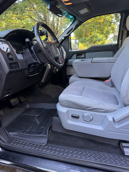 Driver seat, steering wheel, and dashboard after an interior detail
